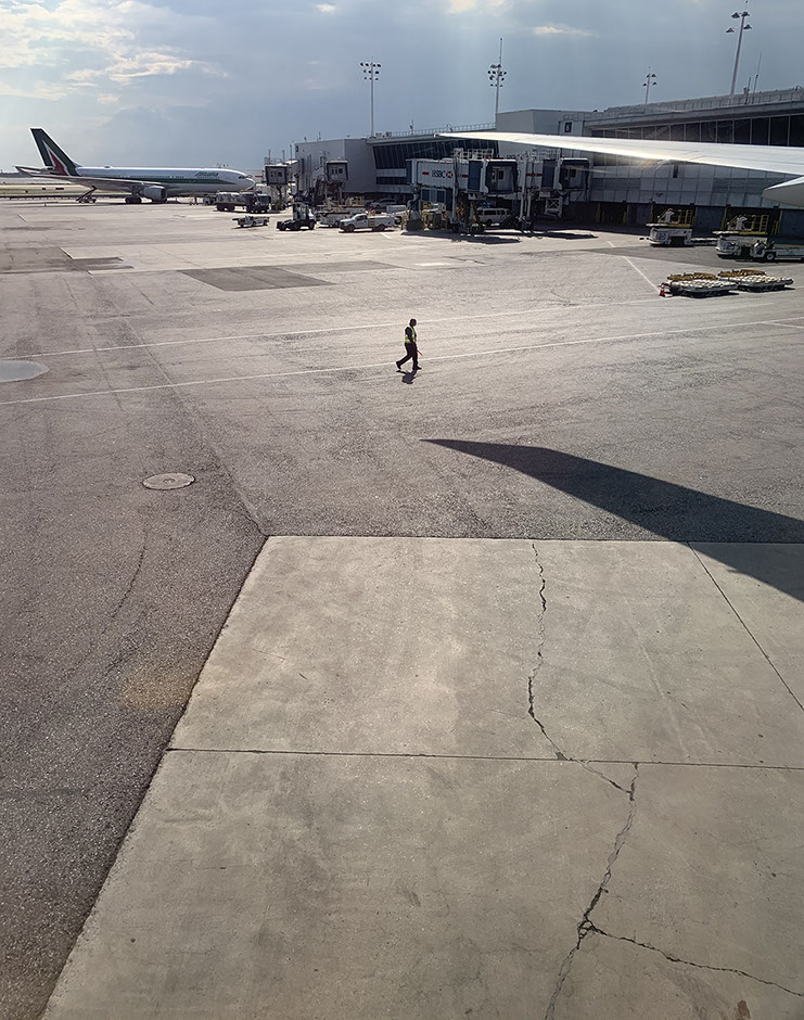a human figure rendered miniscule. the defunct.